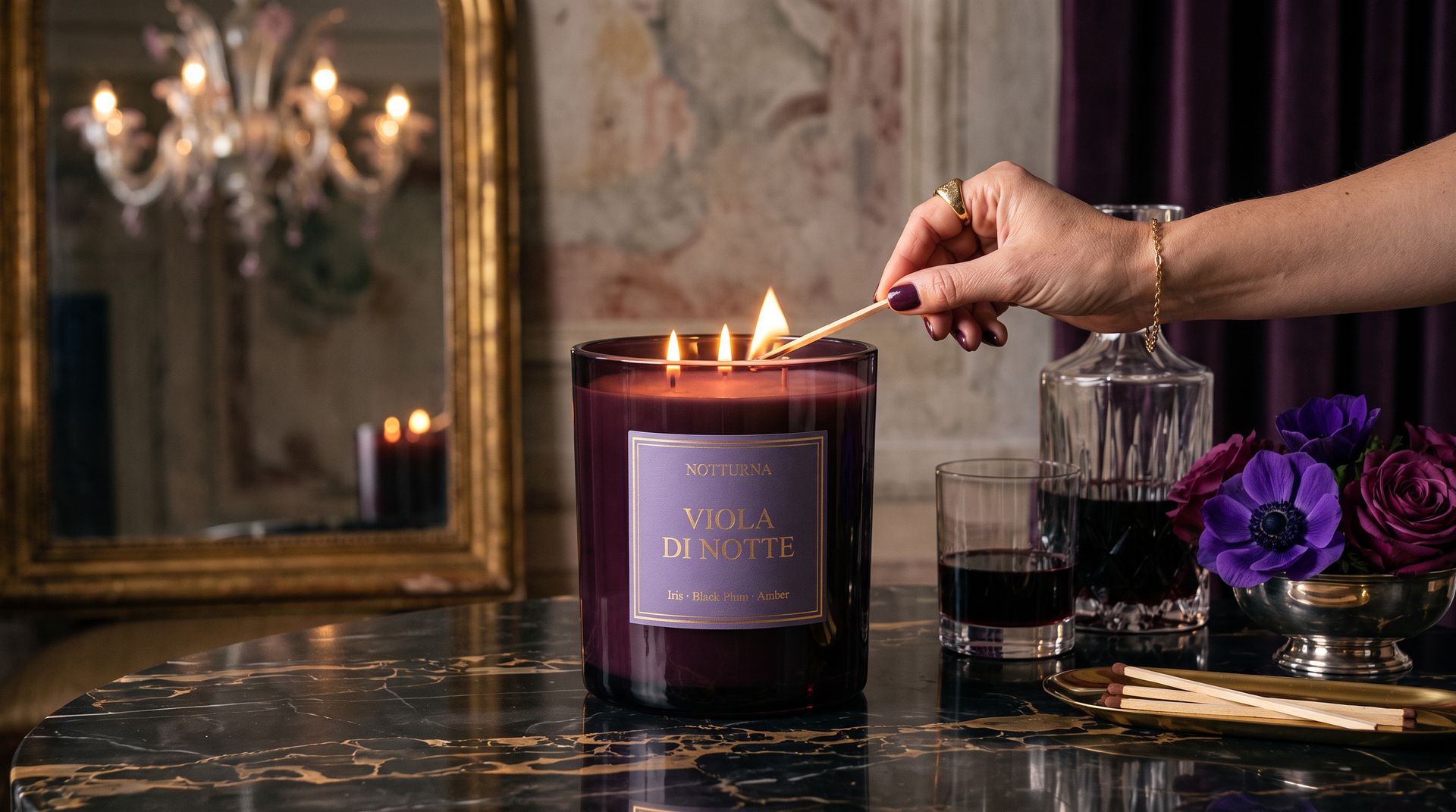 The same candle on black marble in a palazzo salon, a hand lighting the wicks
